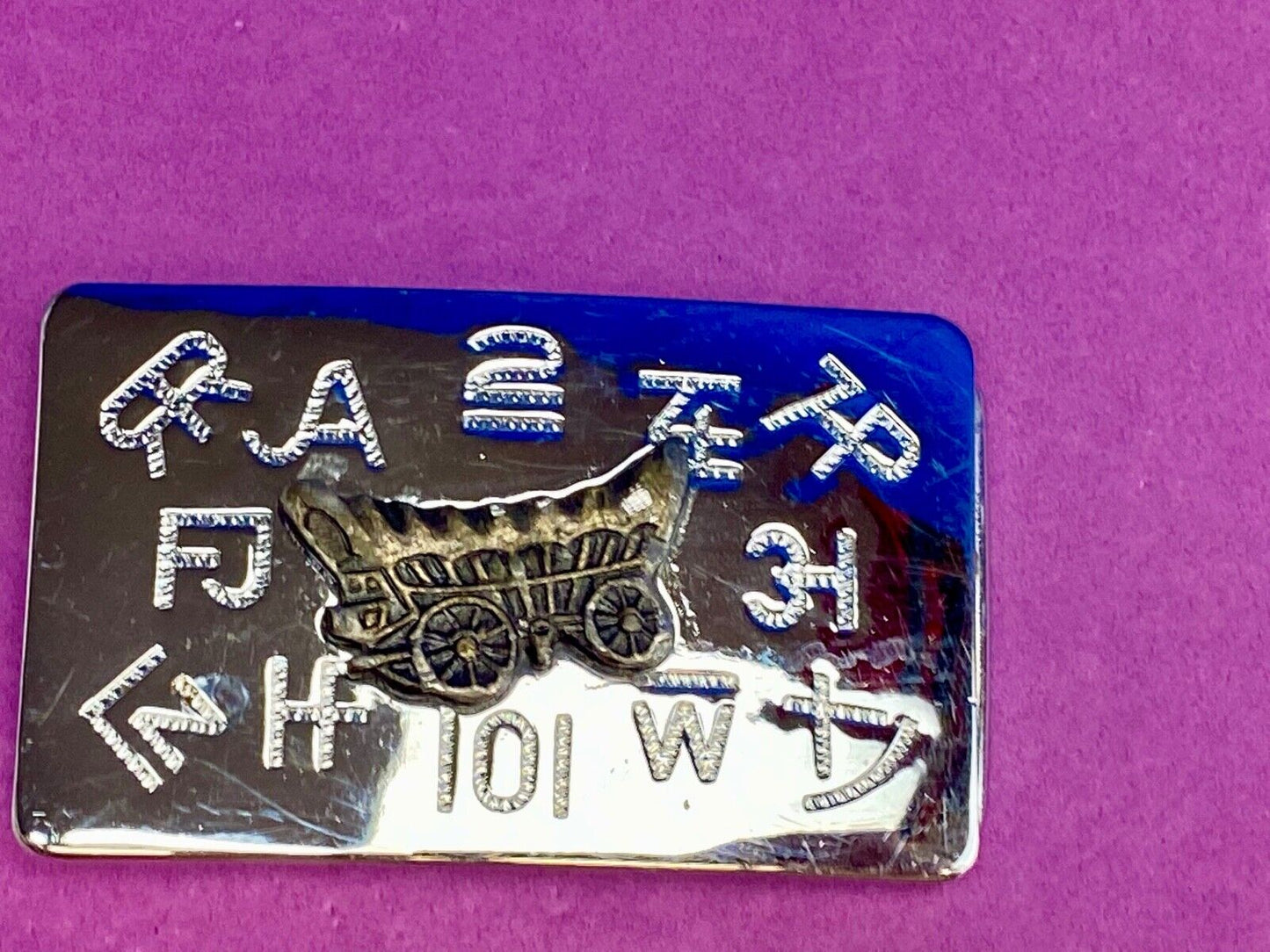 Vintage Chaimbers covered wagon western belt buckle with branding signs marks