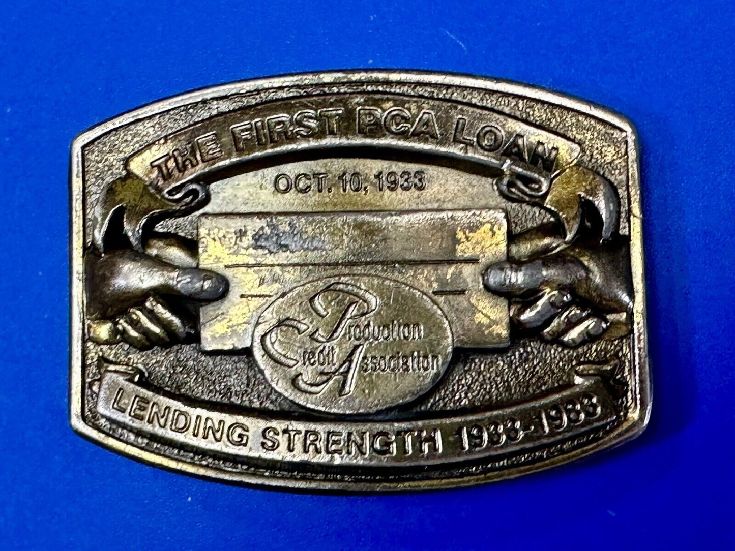 The First PCA loan Production Credit - Vintage The Great American Belt Buckle Co