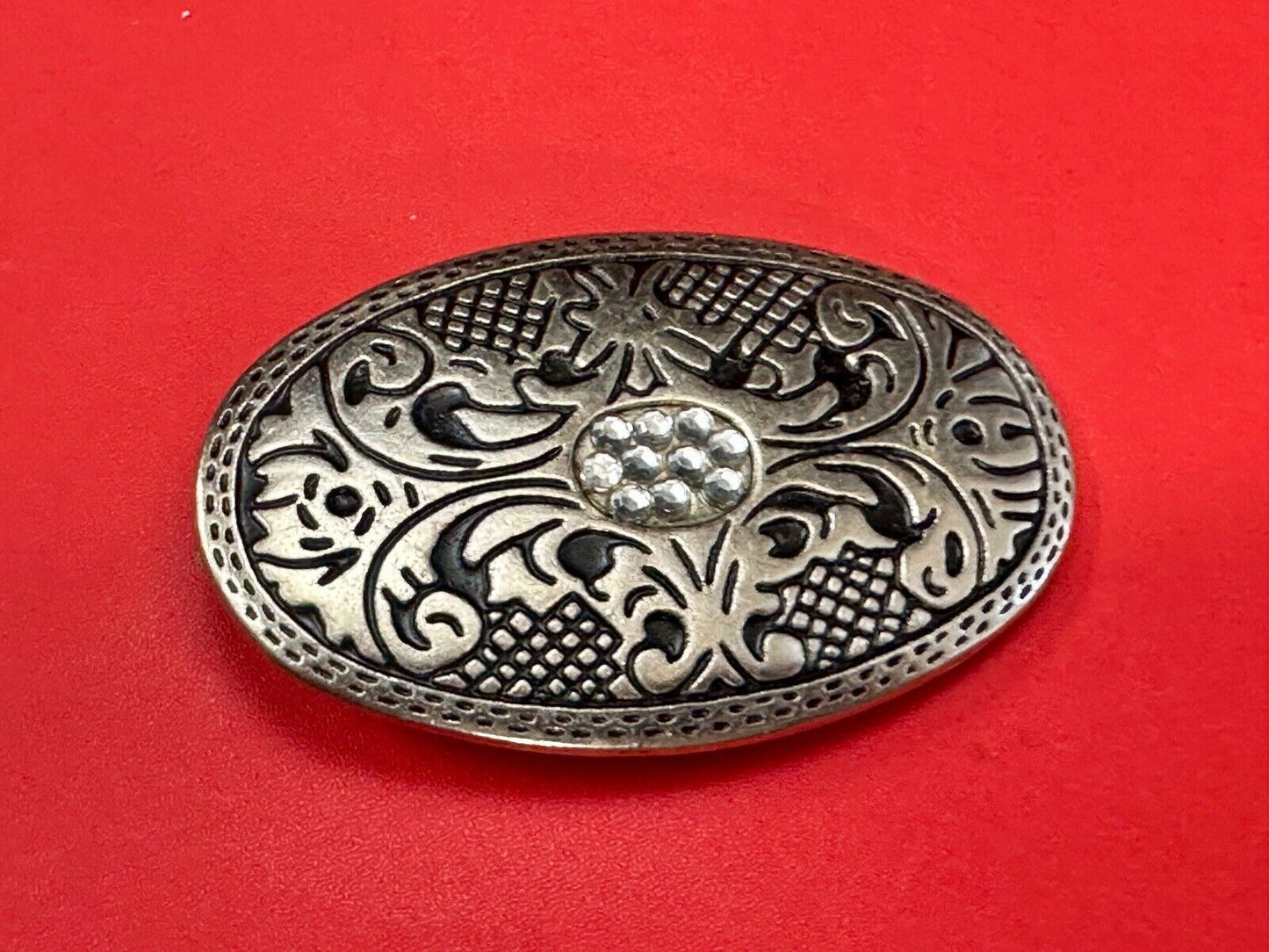 Vintage Cluster Centered in southwestern pattern oval belt buckle