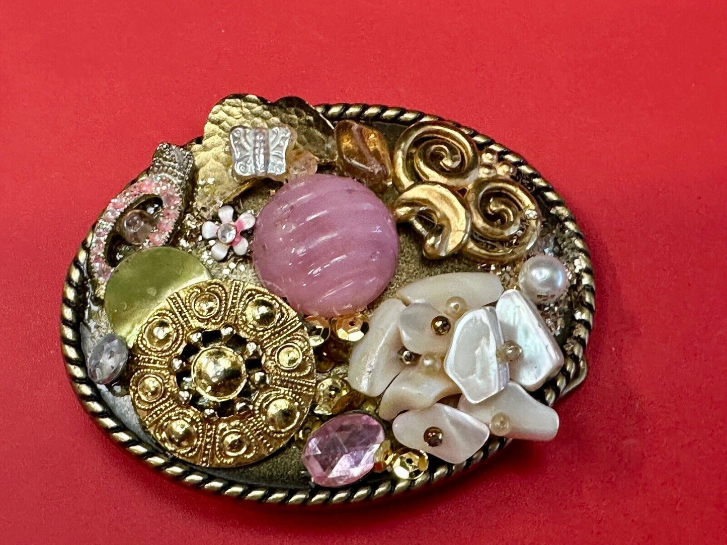 Artisan Abstract flowers made of mixed material on gold tone oval belt buckle