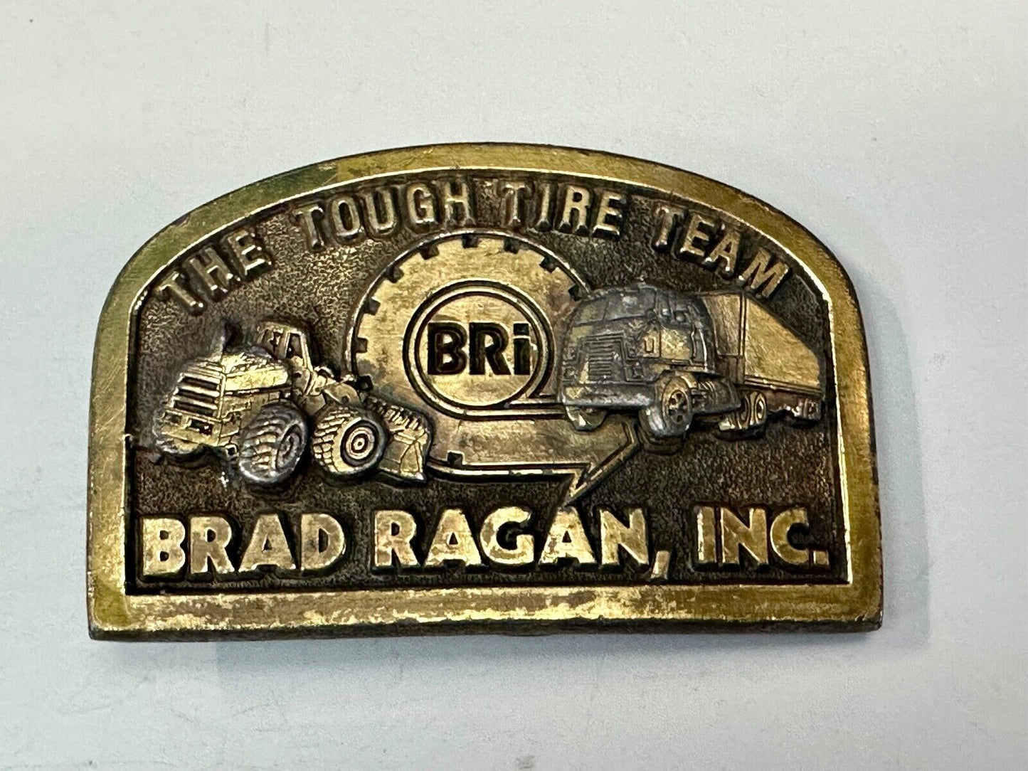 The Tough Tire Team BRi Brad Ragan, Inc. vintage belt buckle by Spec-Cast