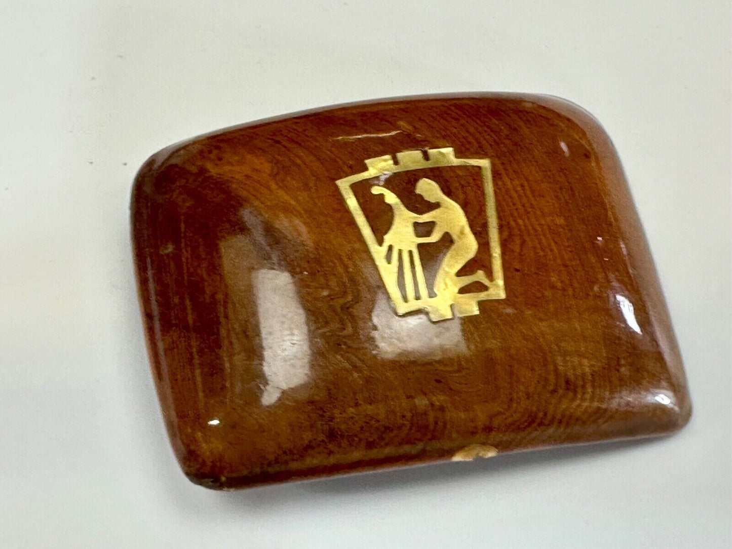 Artisan wooden glossy wood belt buckle with gold color artist scene?