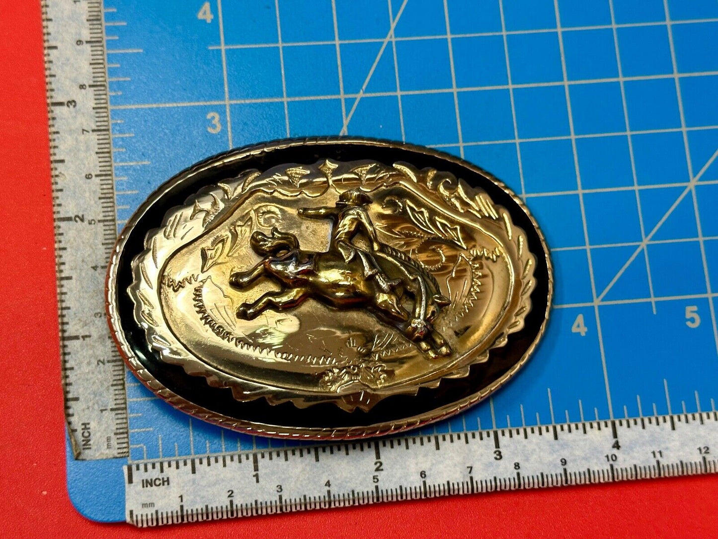 Beautiful Cowboy Saddle Bronc western black silver gold color belt buckle