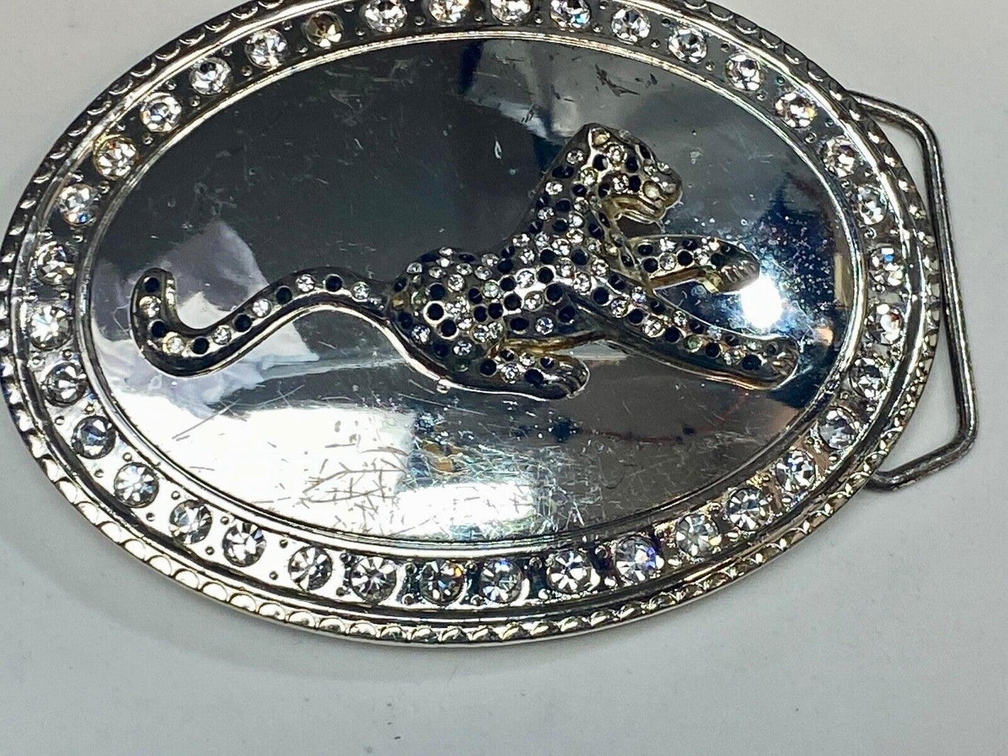 A big Tiger Cat running featured on western oval belt buckle
