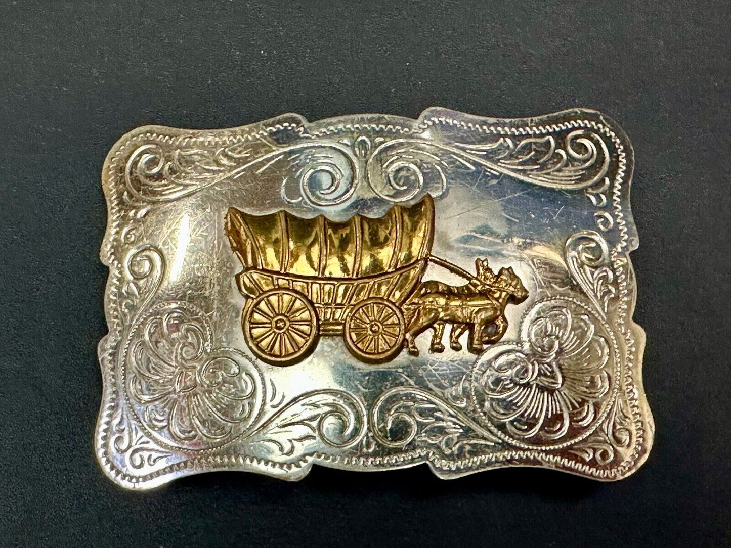 Vintage Covered Wagon two tone ornate cowboys out west flower swirl belt buckle