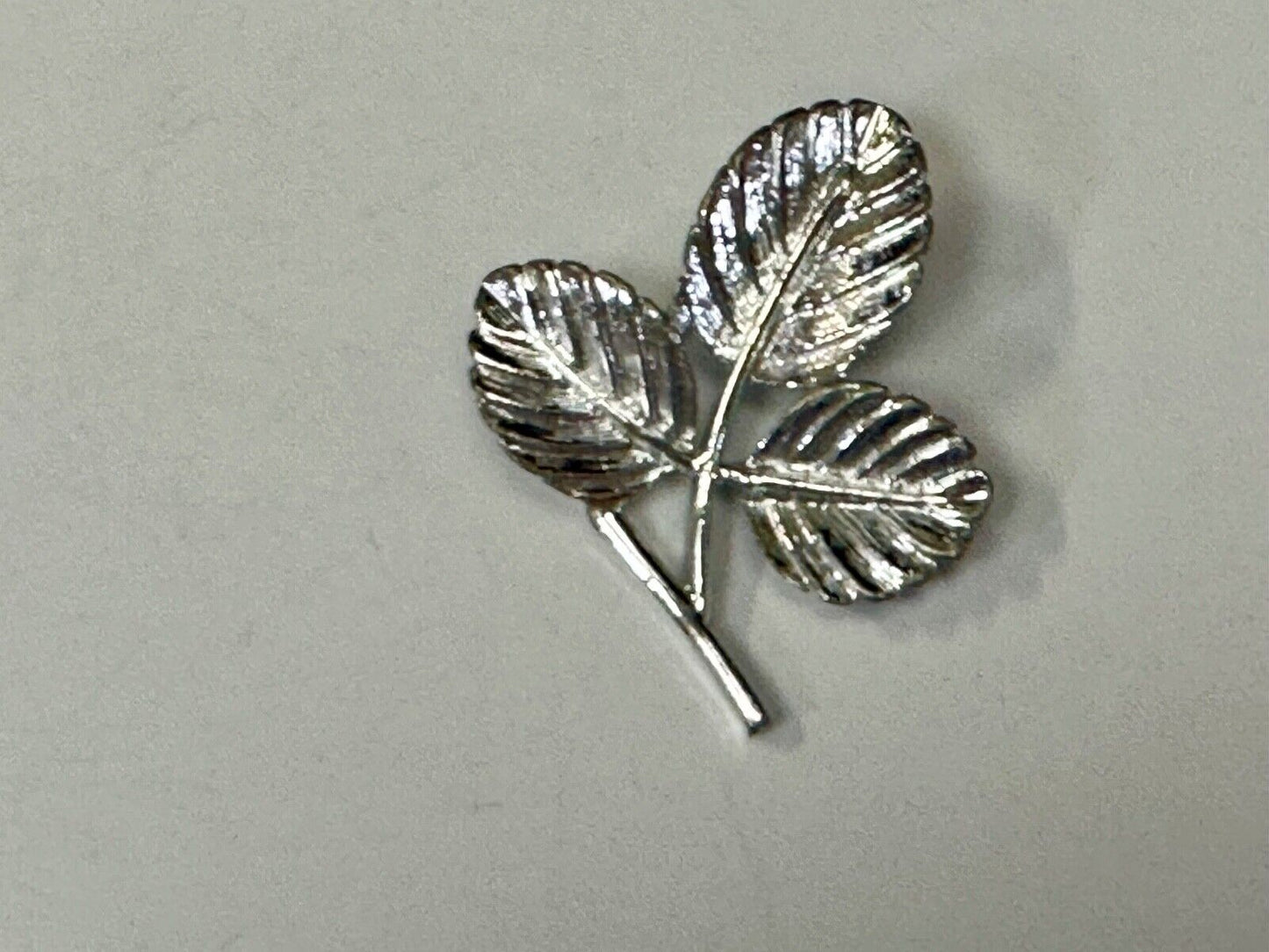 Three Leaf cutout Sarah Coventry signed silver tone brooch pin