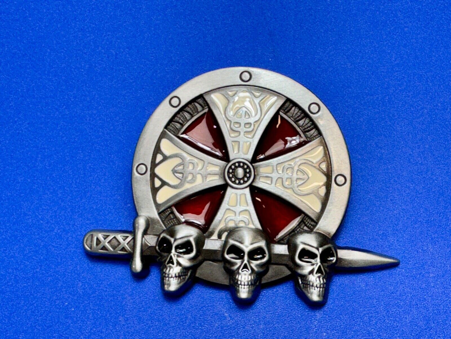 Three skulls with sword through heads on Iron Cross round NOS belt buckle
