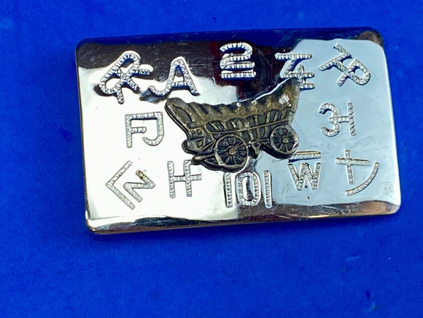Vintage Chaimbers covered wagon western belt buckle with branding signs marks