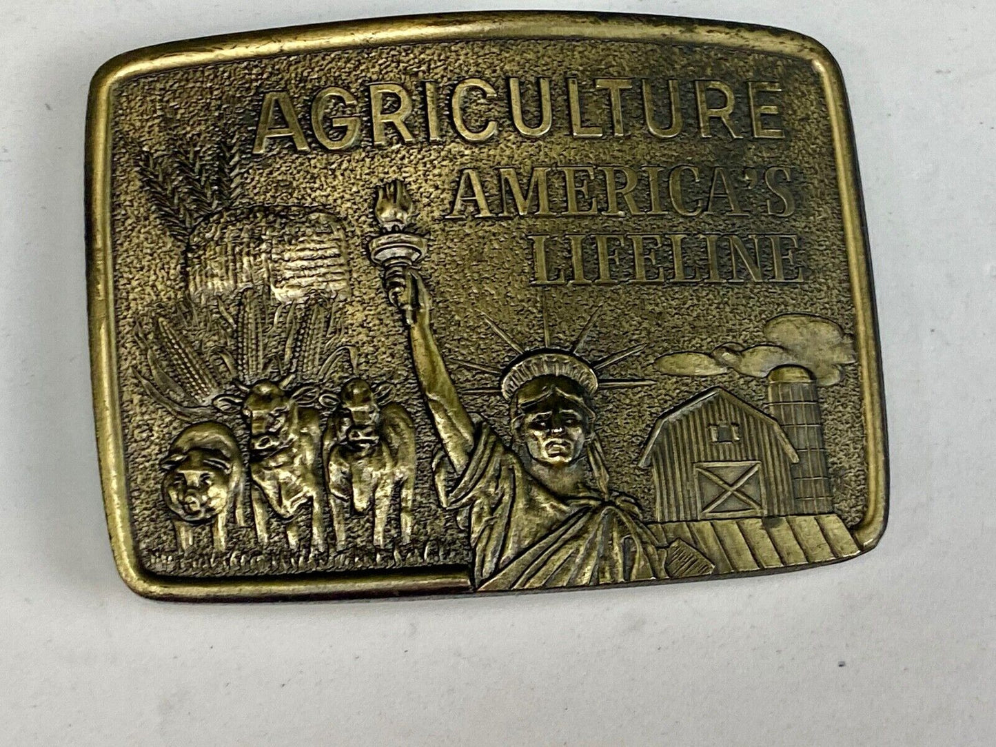 AGRICULTURE, Americas Lifeline belt buckle by Farmhand - Statue of liberty
