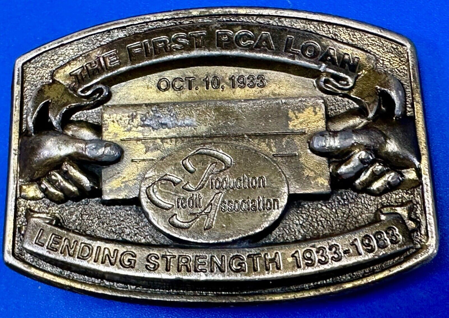 The First PCA loan Production Credit - Vintage The Great American Belt Buckle Co