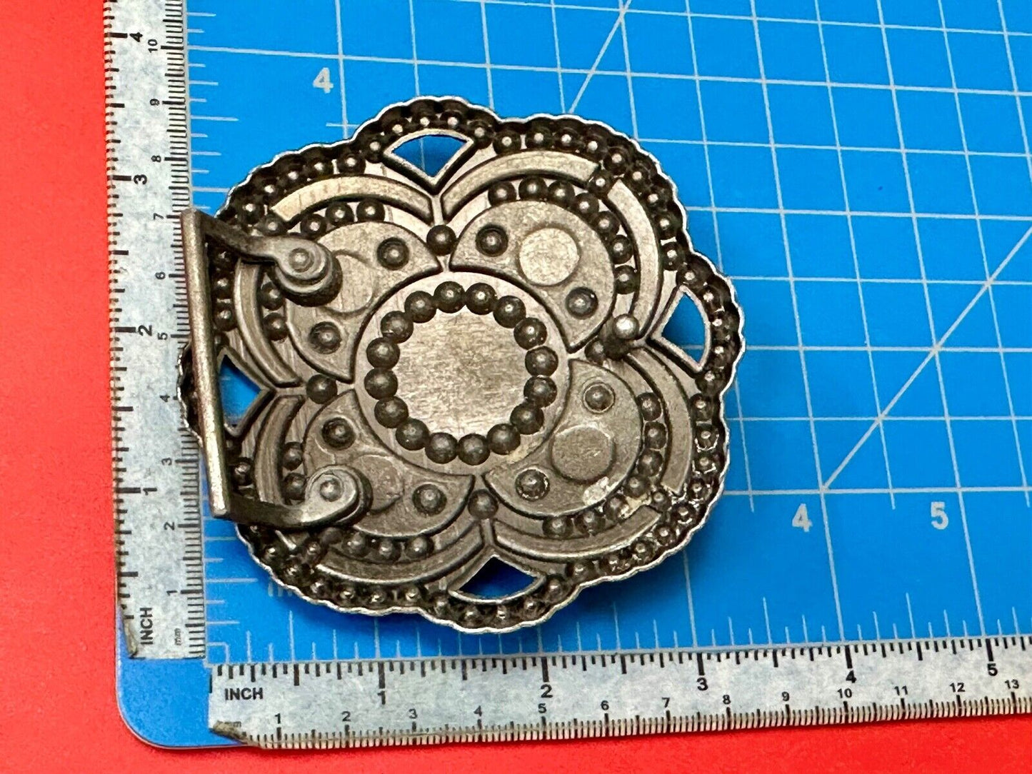 Beautiful Rhinestone accented see through flower shaped cutout belt buckle