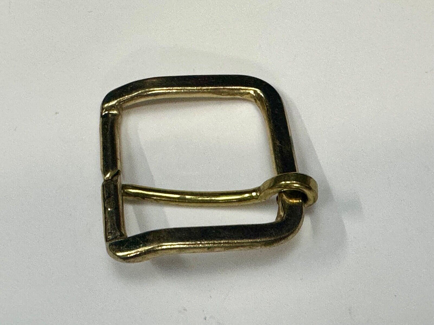 Vintage replacement belt buckle marked W with unique angle