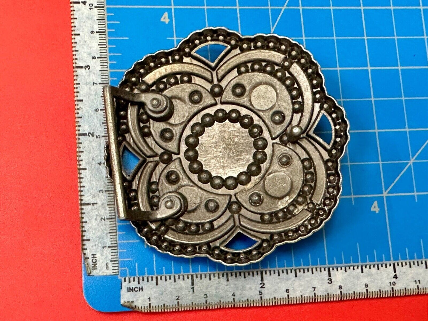 Beautiful Rhinestone accented see through flower shaped cutout belt buckle