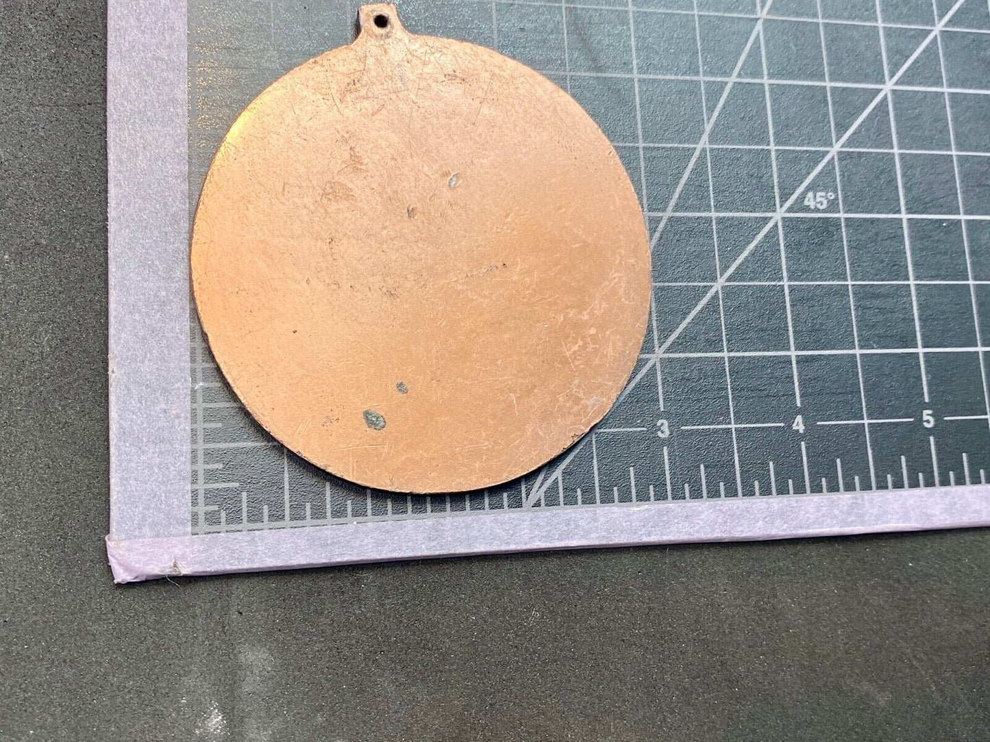 award round medal from El Tour De Tucson HUNGER Race