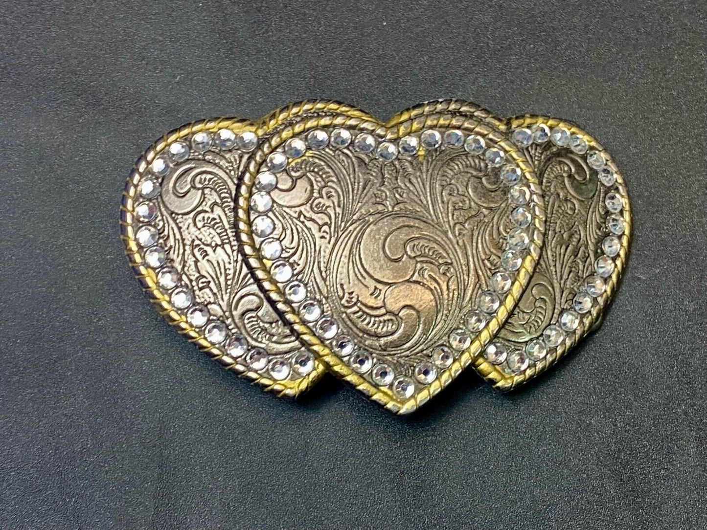 Three hearts ornate flower swirl belt buckle with thick rhinestone boarder
