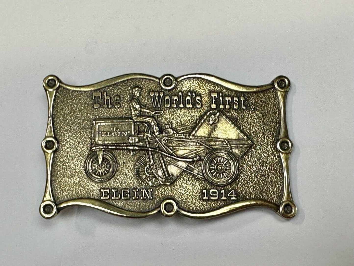 The Elgin, The worlds first tree sweeper commemorative belt buckle by Lewis