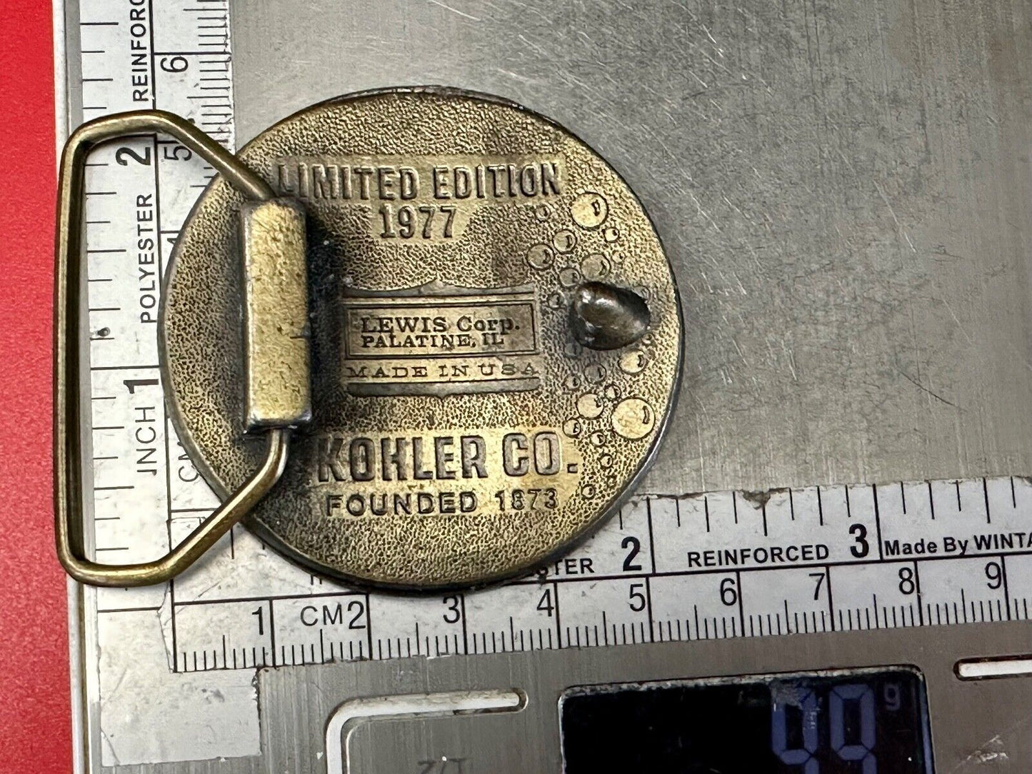 The Bold Look of Kohler Vintage 1977 Lewis round Limited Edition belt buckle