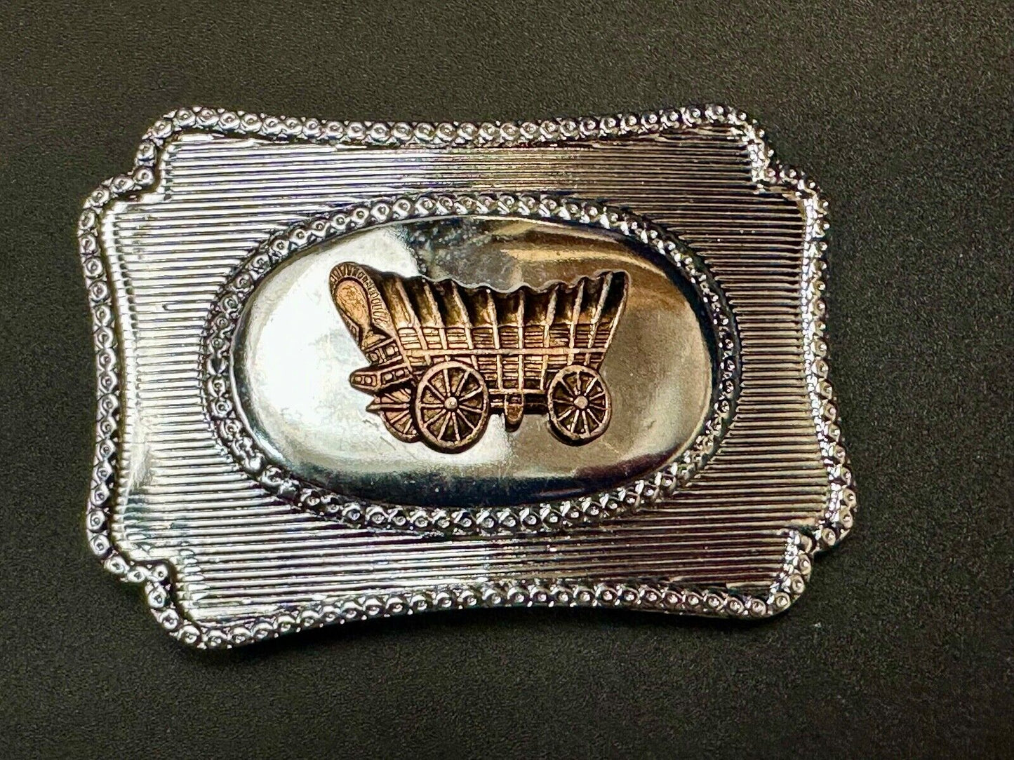 Vintage covered wagon western horse drawn transportation belt buckle