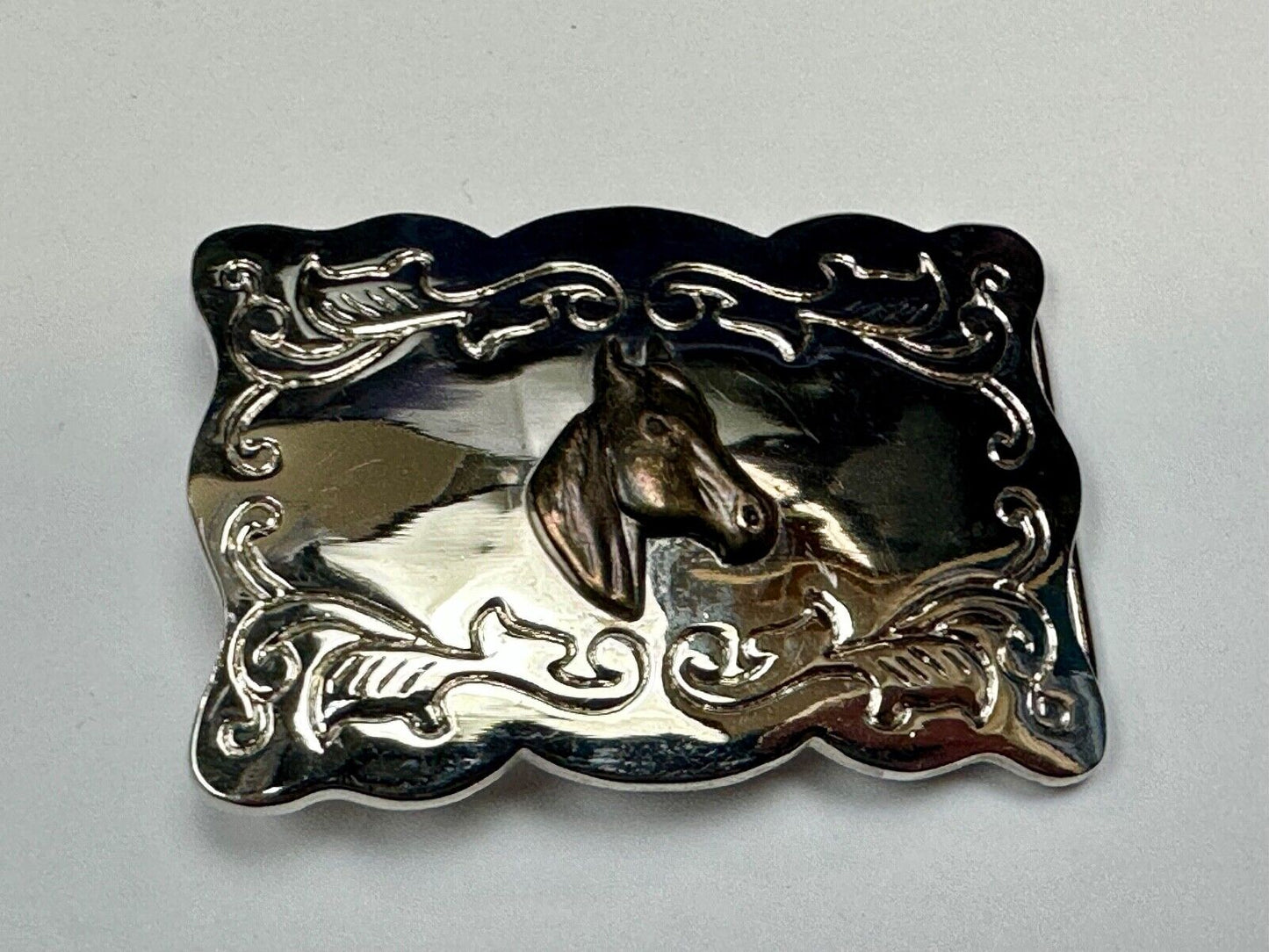 Vintage horse head centered on western rectangular two tone belt buckle