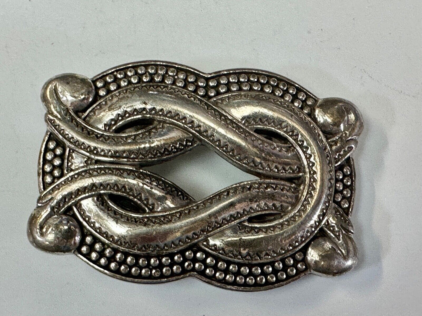 Vintage knot pattern see through silver tone belt buckle