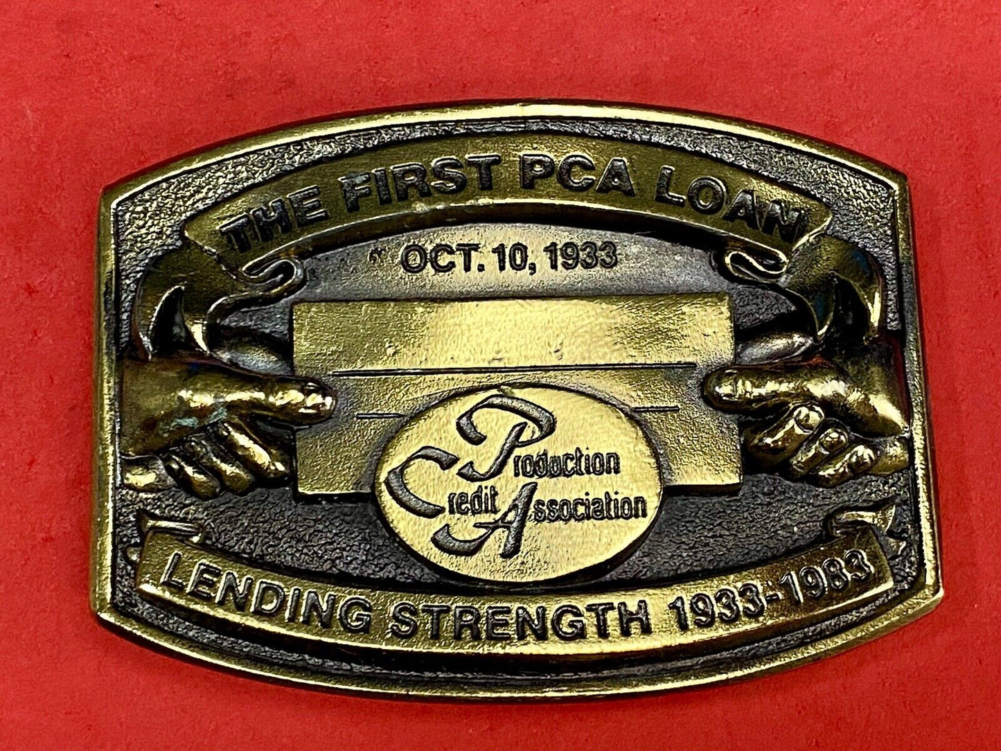 The First PCA loan Production Credit Assn. The Great American Belt Buckle Co