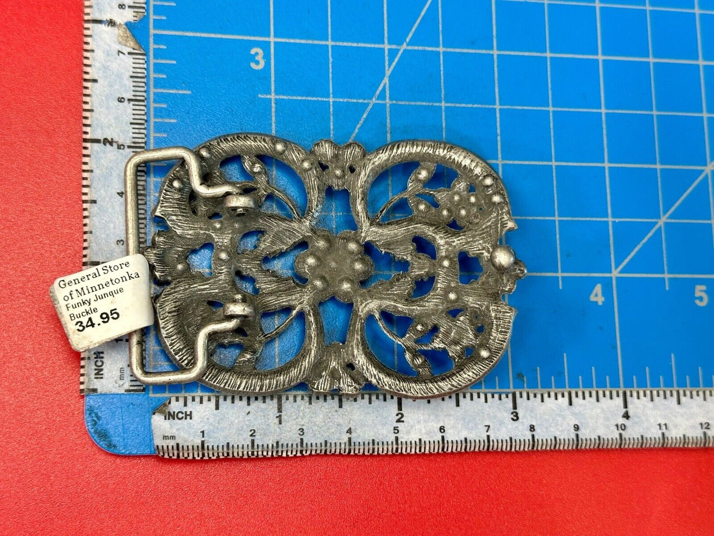 Black rhinestone accented metal flower pattern NOS Funky Junque belt buckle