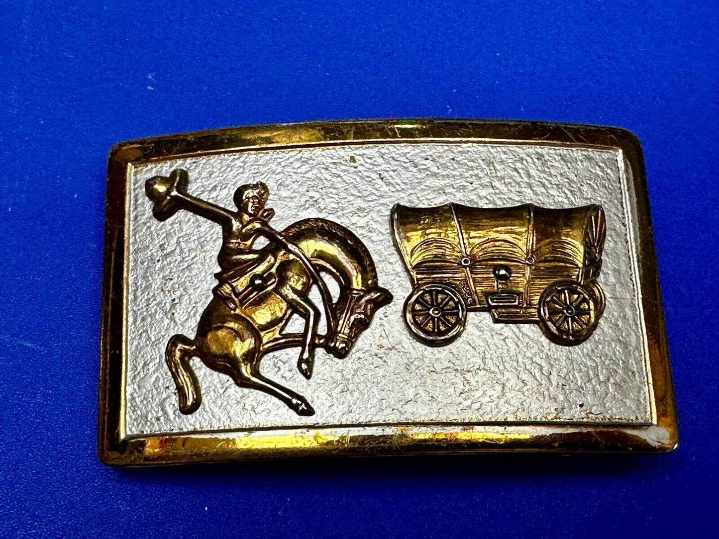 Vintage Cowboy Saddle Bronc western Covered wagon gold tone belt buckle