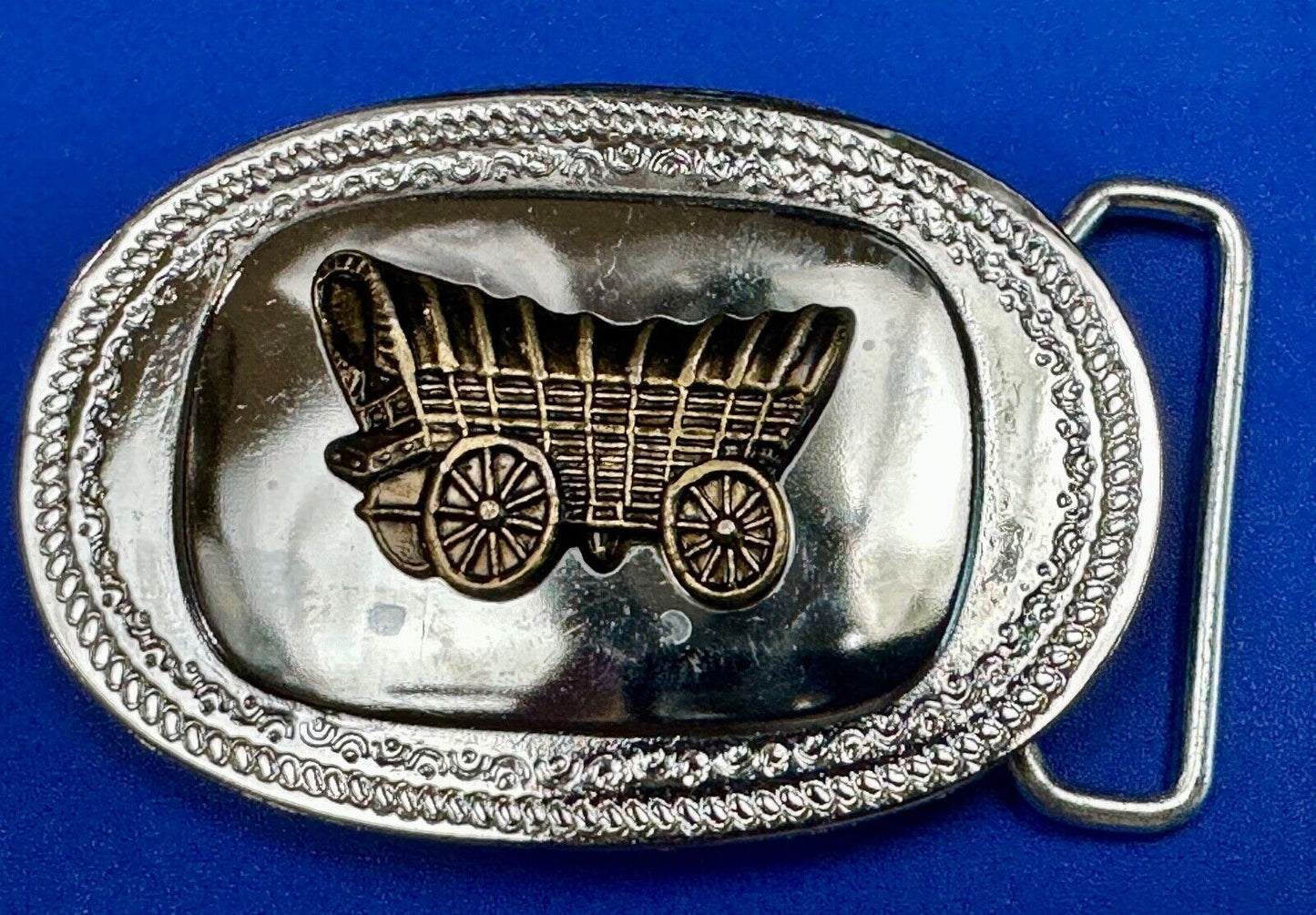 Vintage Covered Wagon on reflective oval two tone western belt buckle