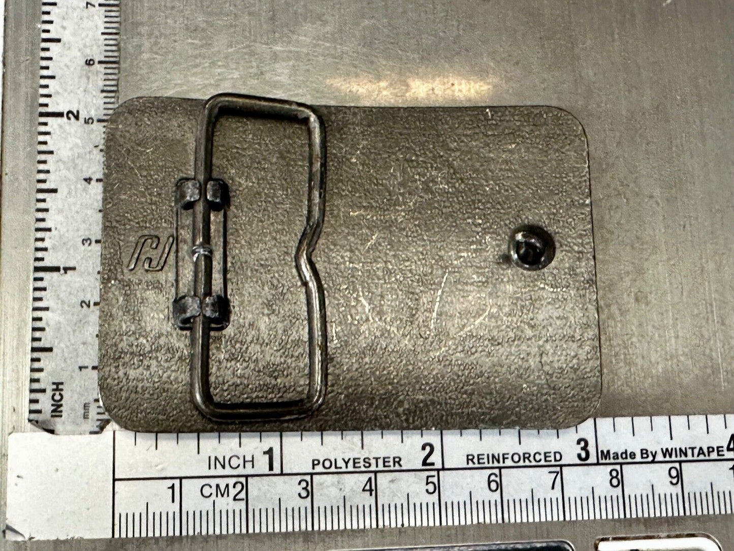 Austin Texas Distributing and Manufacturing 1982 Advertisement Promo Belt Buckle
