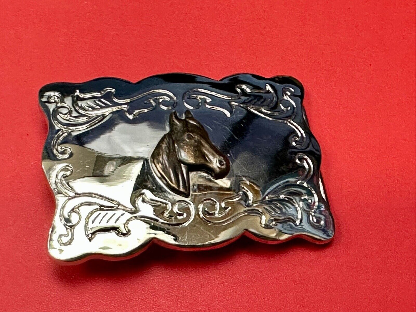 Vintage horse head centered on western rectangular two tone belt buckle