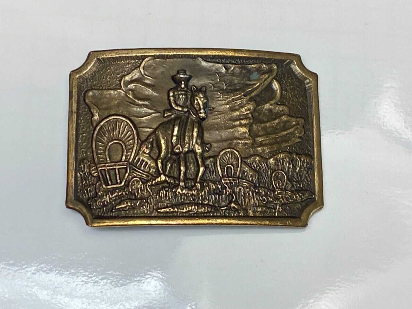 Tall in the Saddle - Covered Wagon Cowboy brass tone western belt buckle