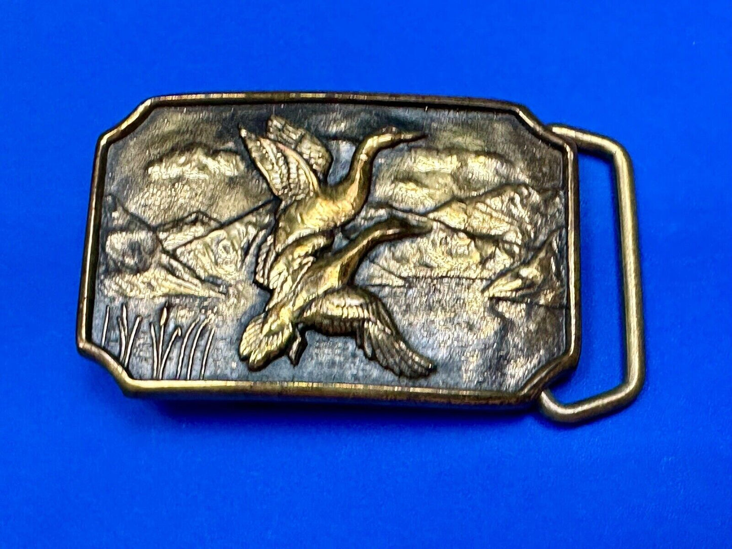 Two ducks flying from pond cat tails Nature Solid Brass belt buckle by BTS