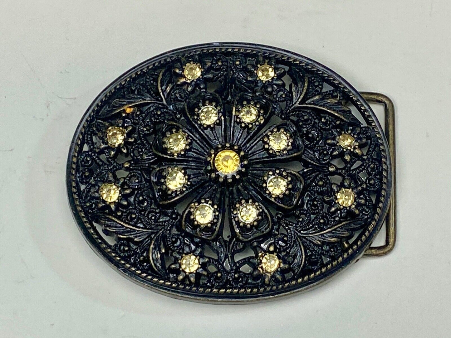 BEAUTIFUL Yellow rhinestones mounted in oval shaped flower theme belt buckle