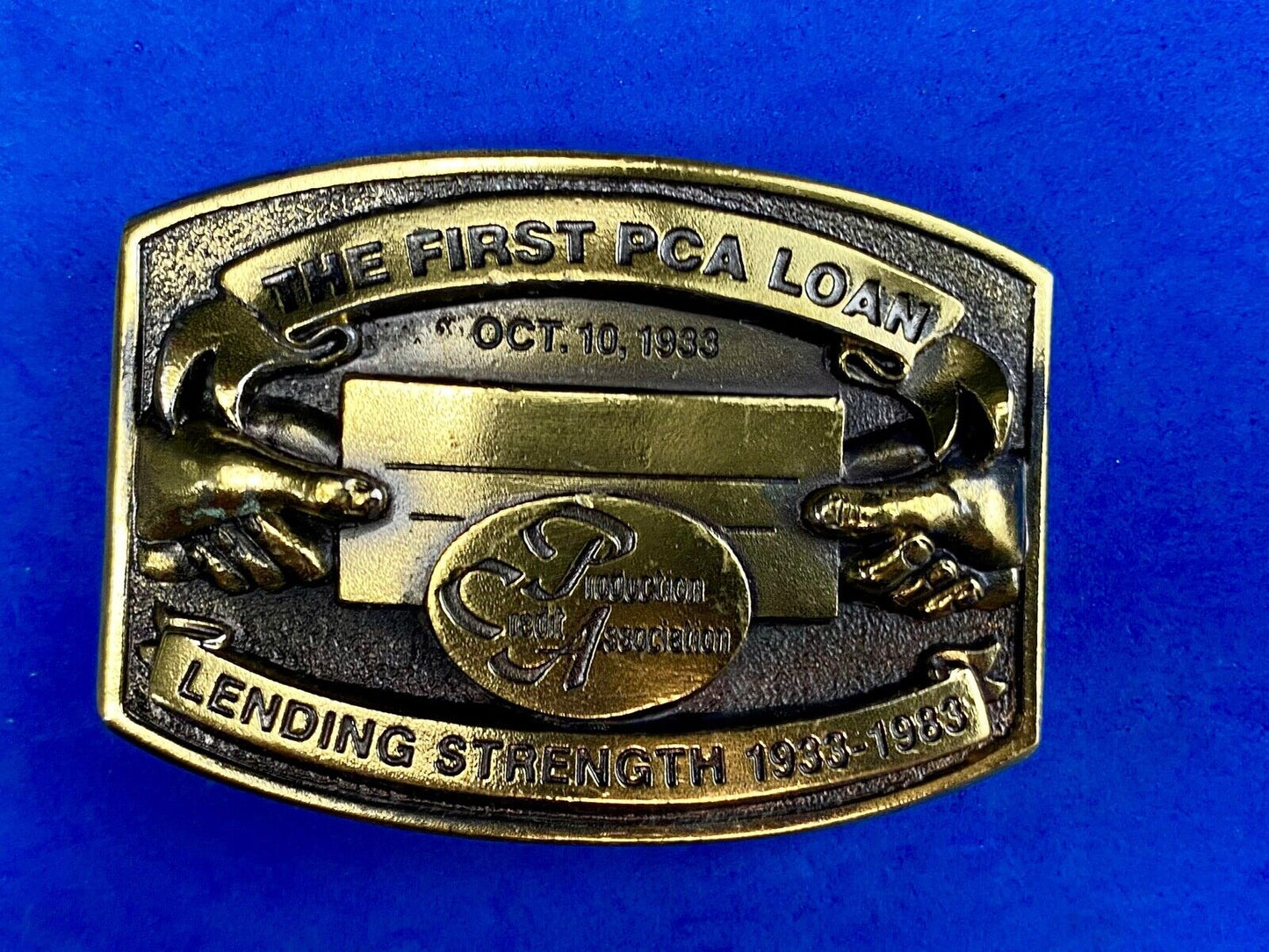 The First PCA loan Production Credit Assn. The Great American Belt Buckle Co