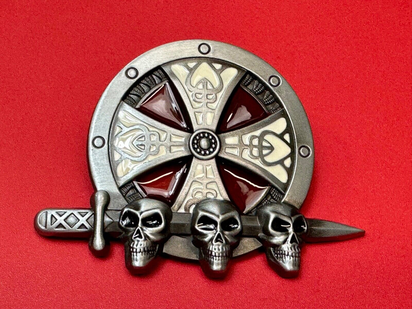 Three skulls with sword through heads on Iron Cross round NOS belt buckle