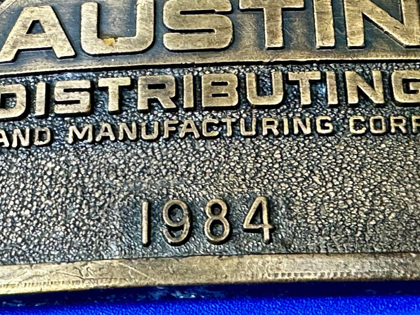 Austin Texas Distributing and Manufacturing 1984 Advertisement Promo Belt Buckle
