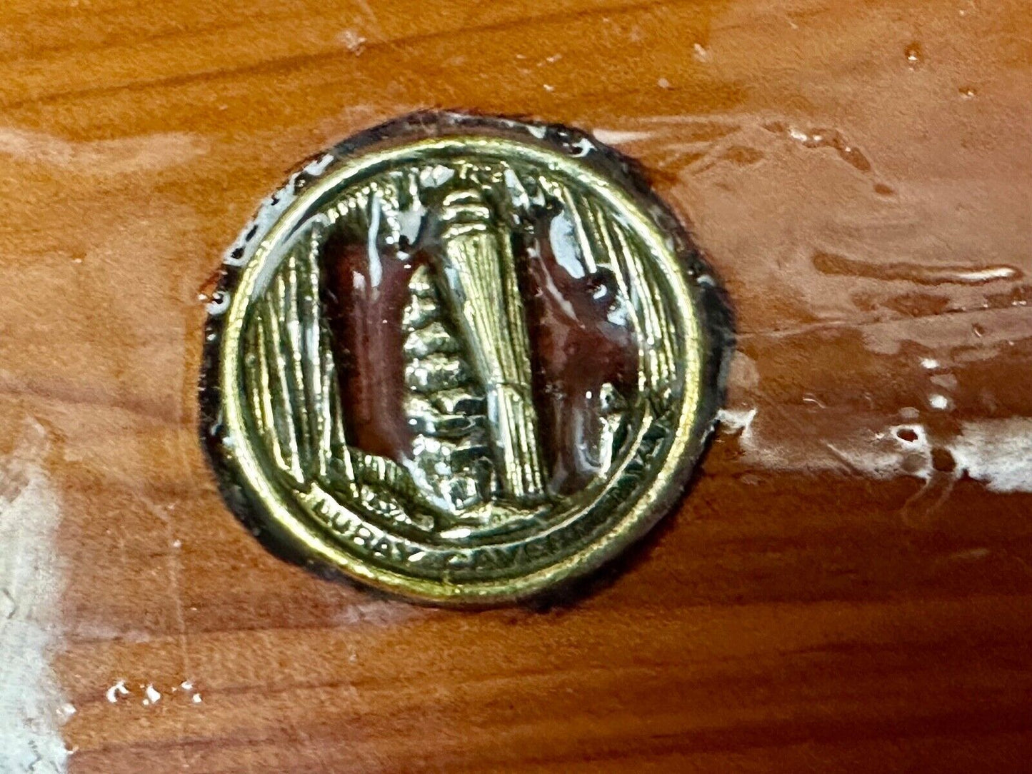 Artisan wood belt buckle with inlaid Luary Caverns cave token coin