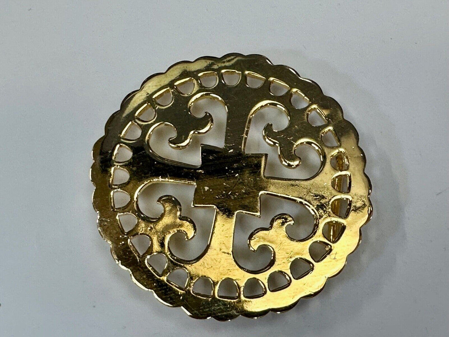 vintage Celtic pattern round cutout belt buckle by designer Ann Lansing