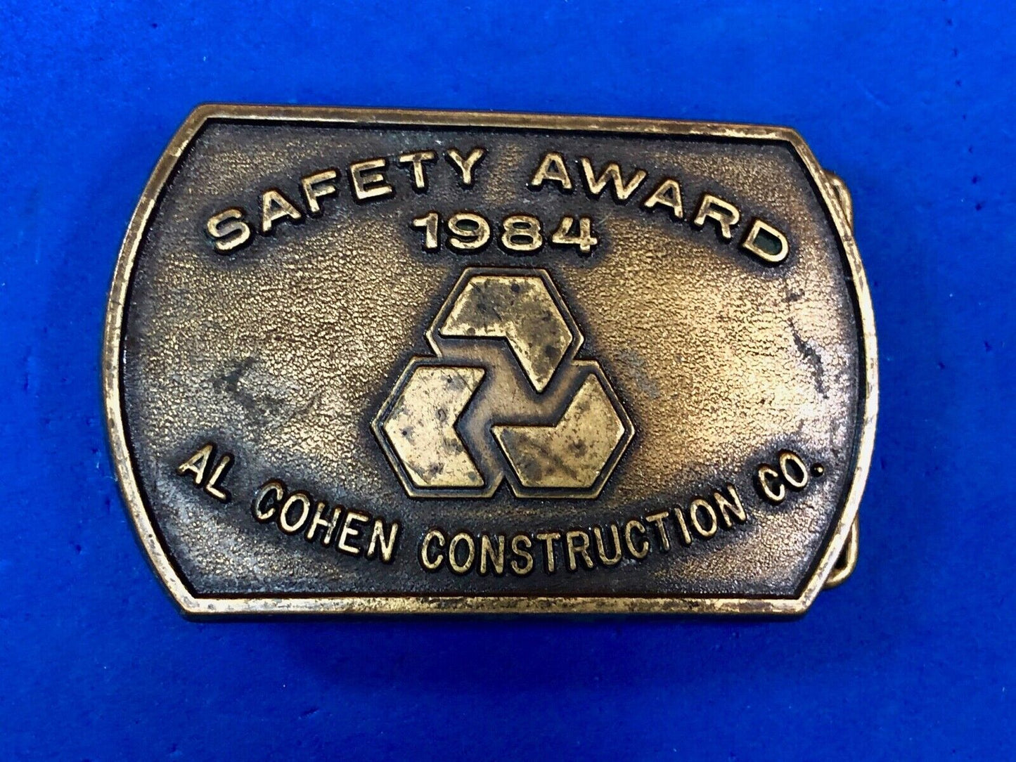 Vintage 1984 AL Cohen Construction Company promotional belt buckle safety award