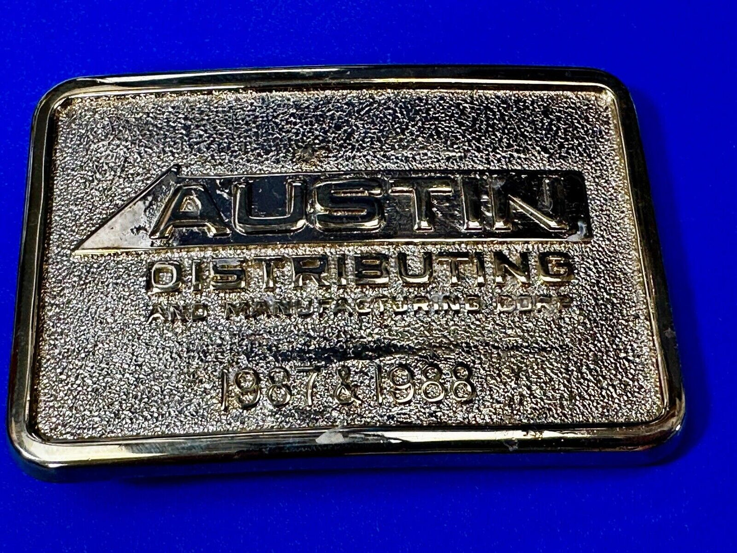 Austin Texas Distributing and Manufacturing 1987 Gold Tone Belt Buckle