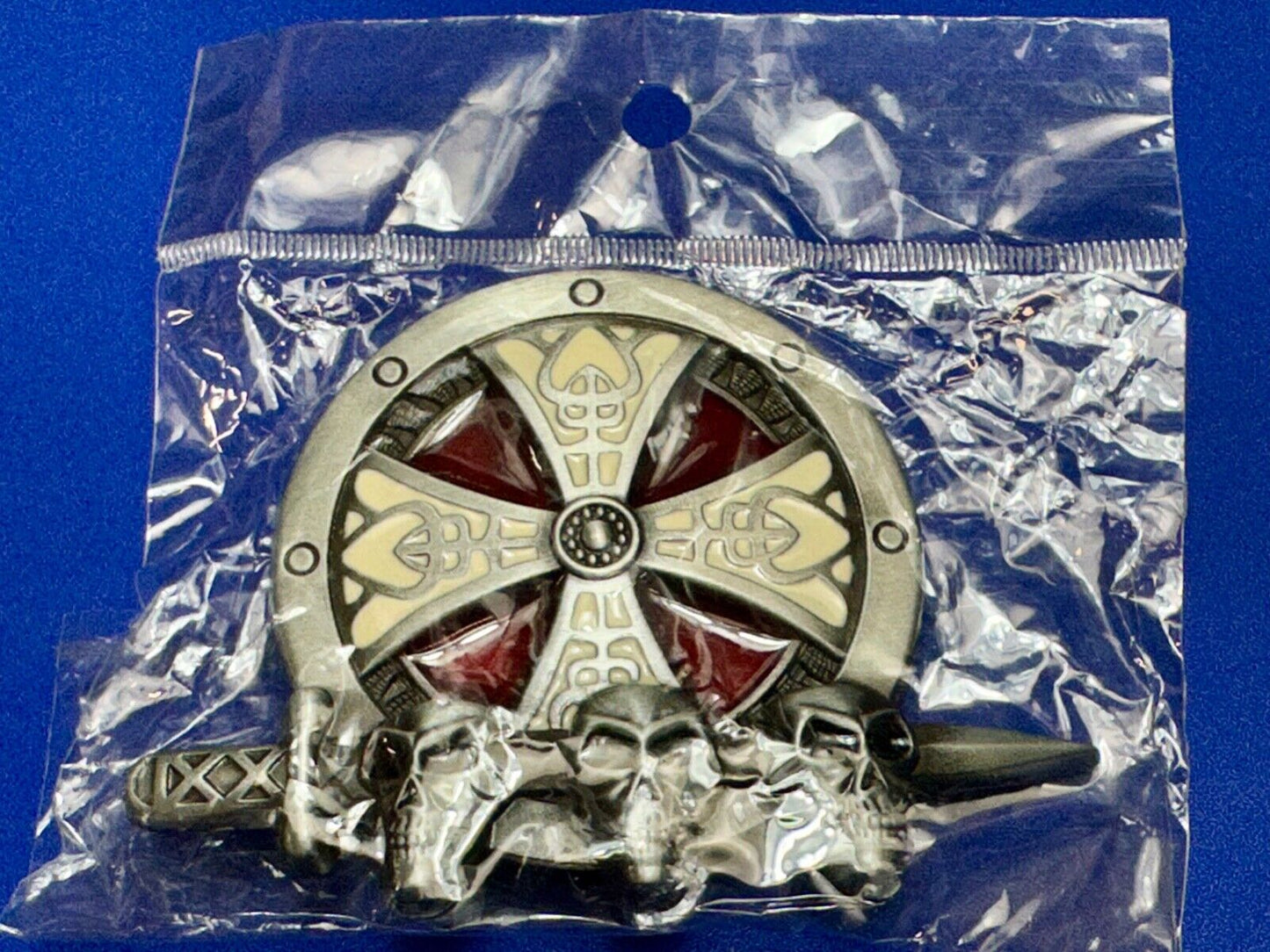 Three skulls with sword through heads on Iron Cross round NOS belt buckle