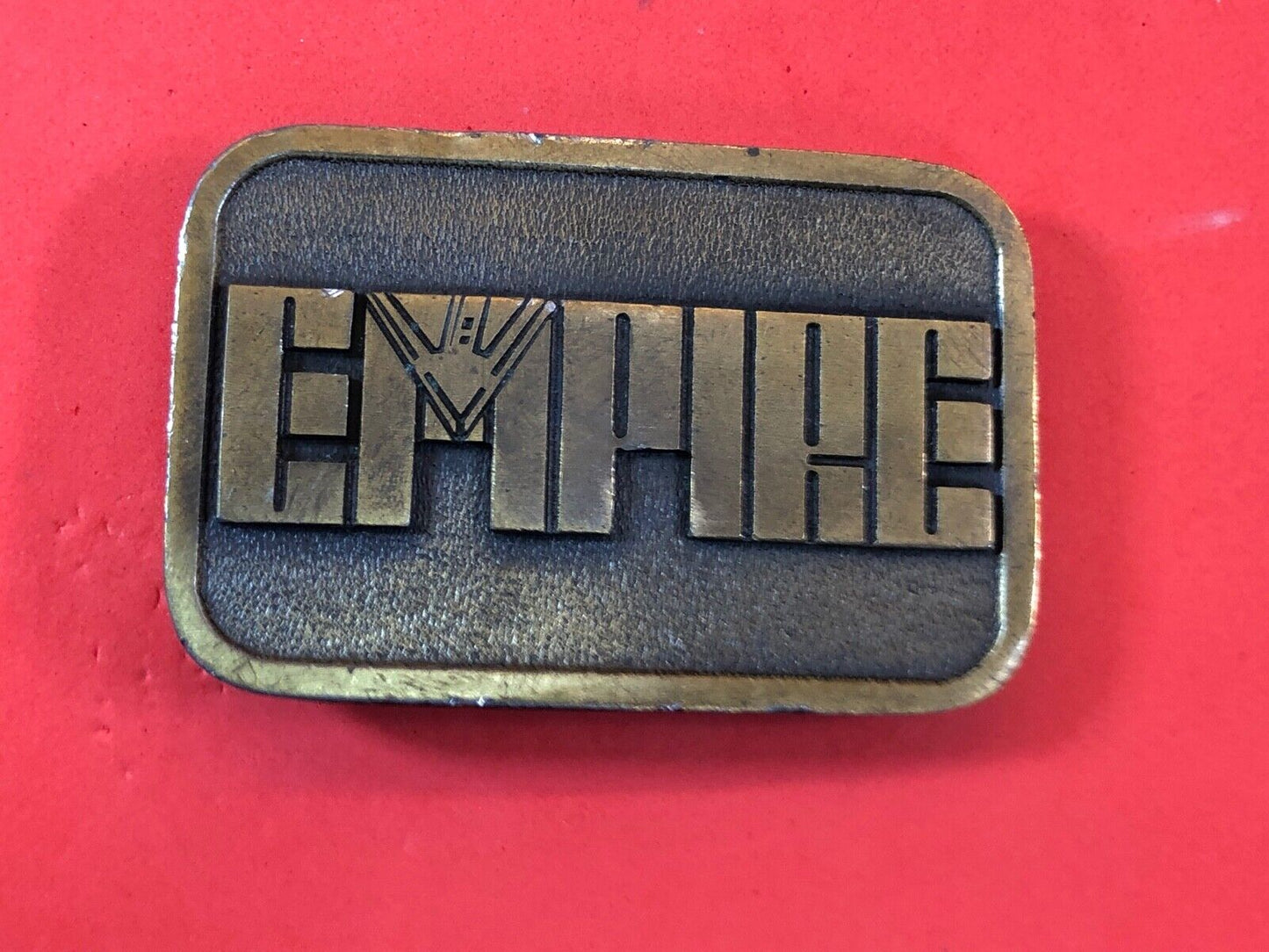Vintage Empire Belt Buckle signed FEMA 1984