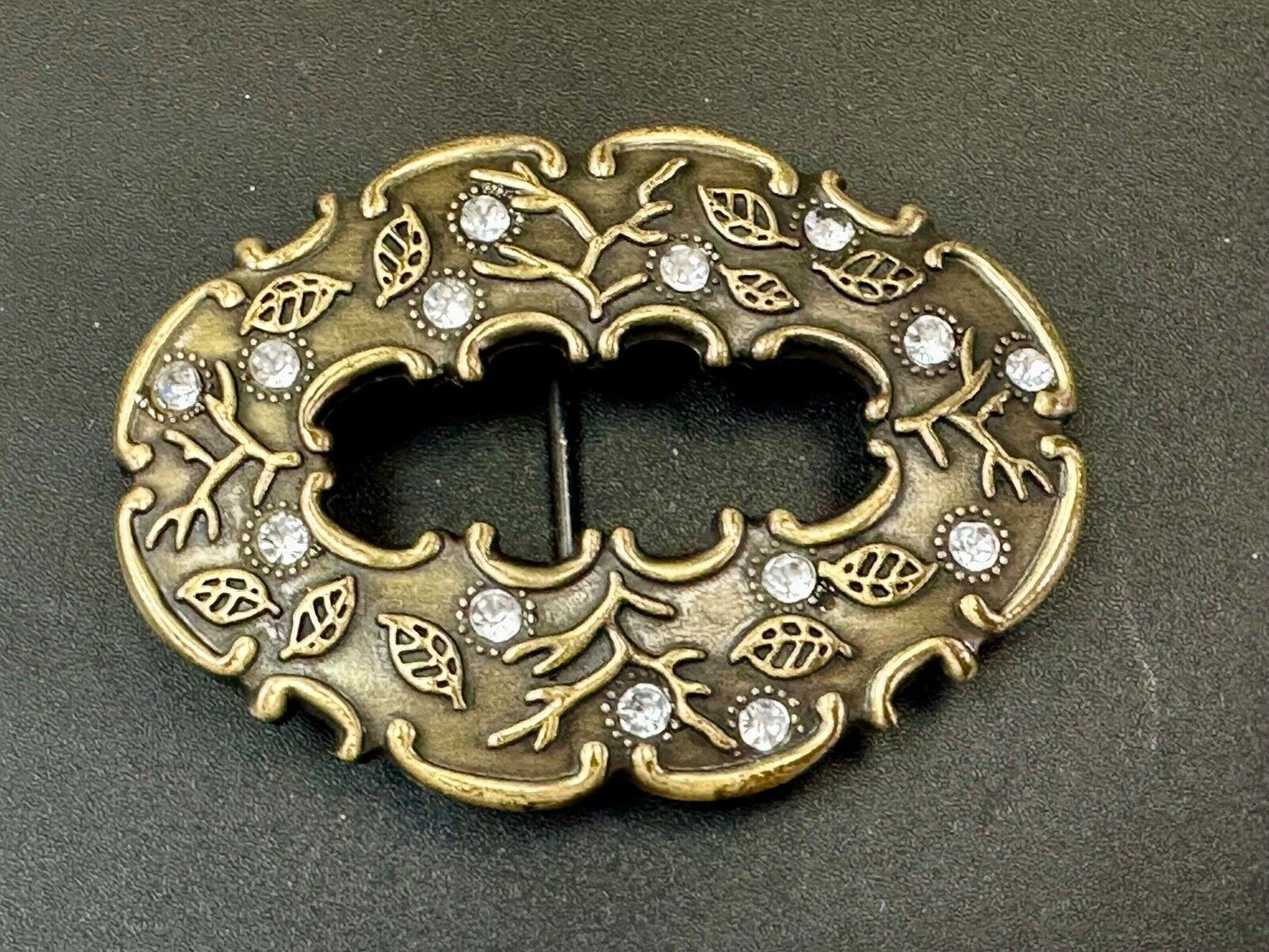 3" wide brown rhinestone accented leaf pattern semi oval belt buckle