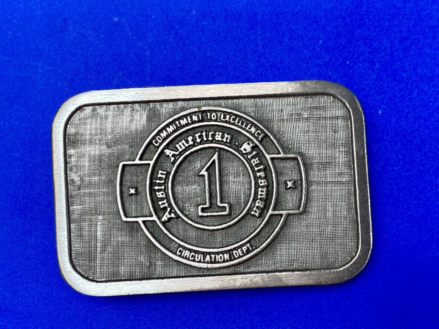 Asian American Circulation Dept Commitment to excellence belt buckle hit-line