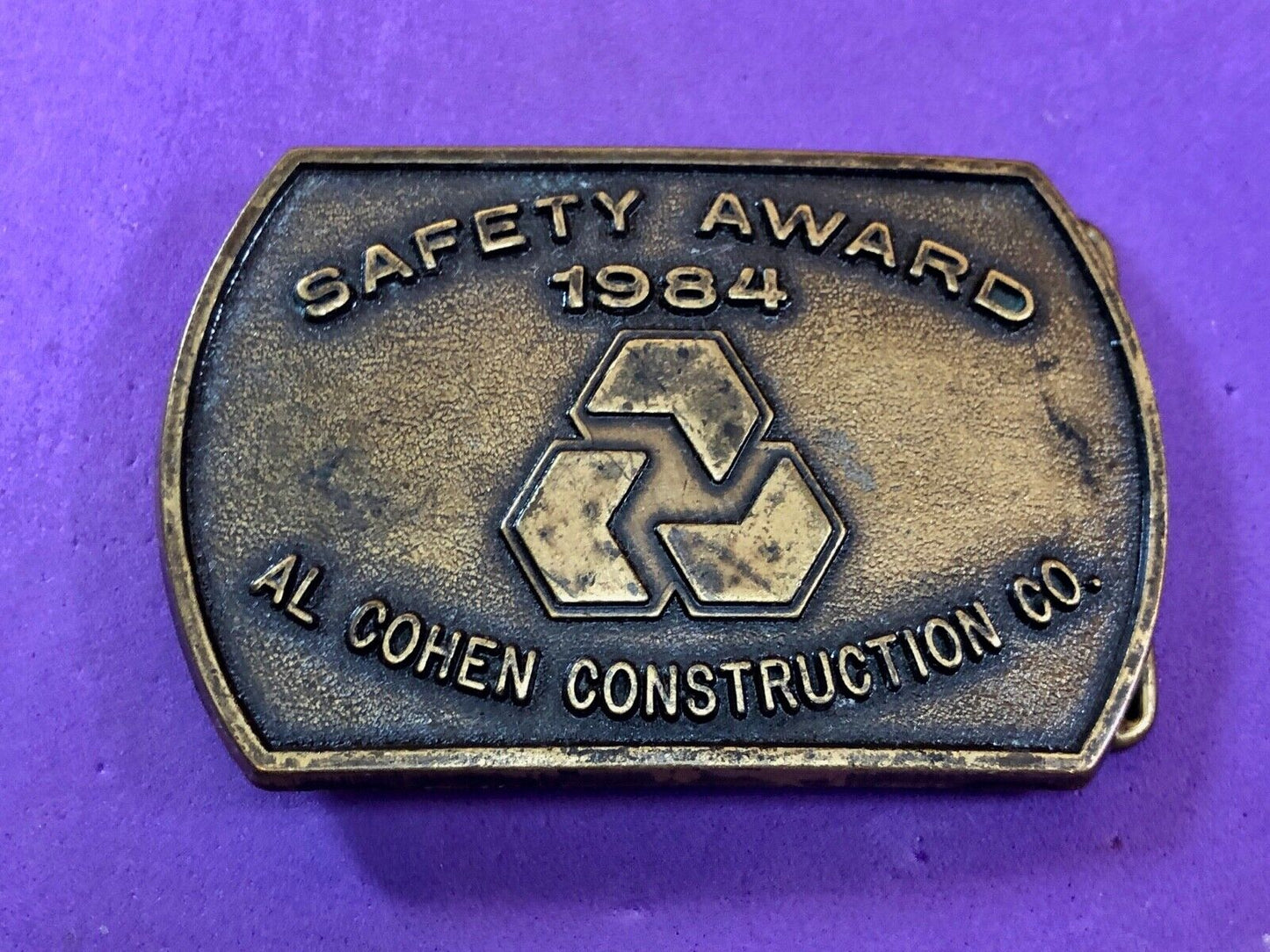 Vintage 1984 AL Cohen Construction Company promotional belt buckle safety award
