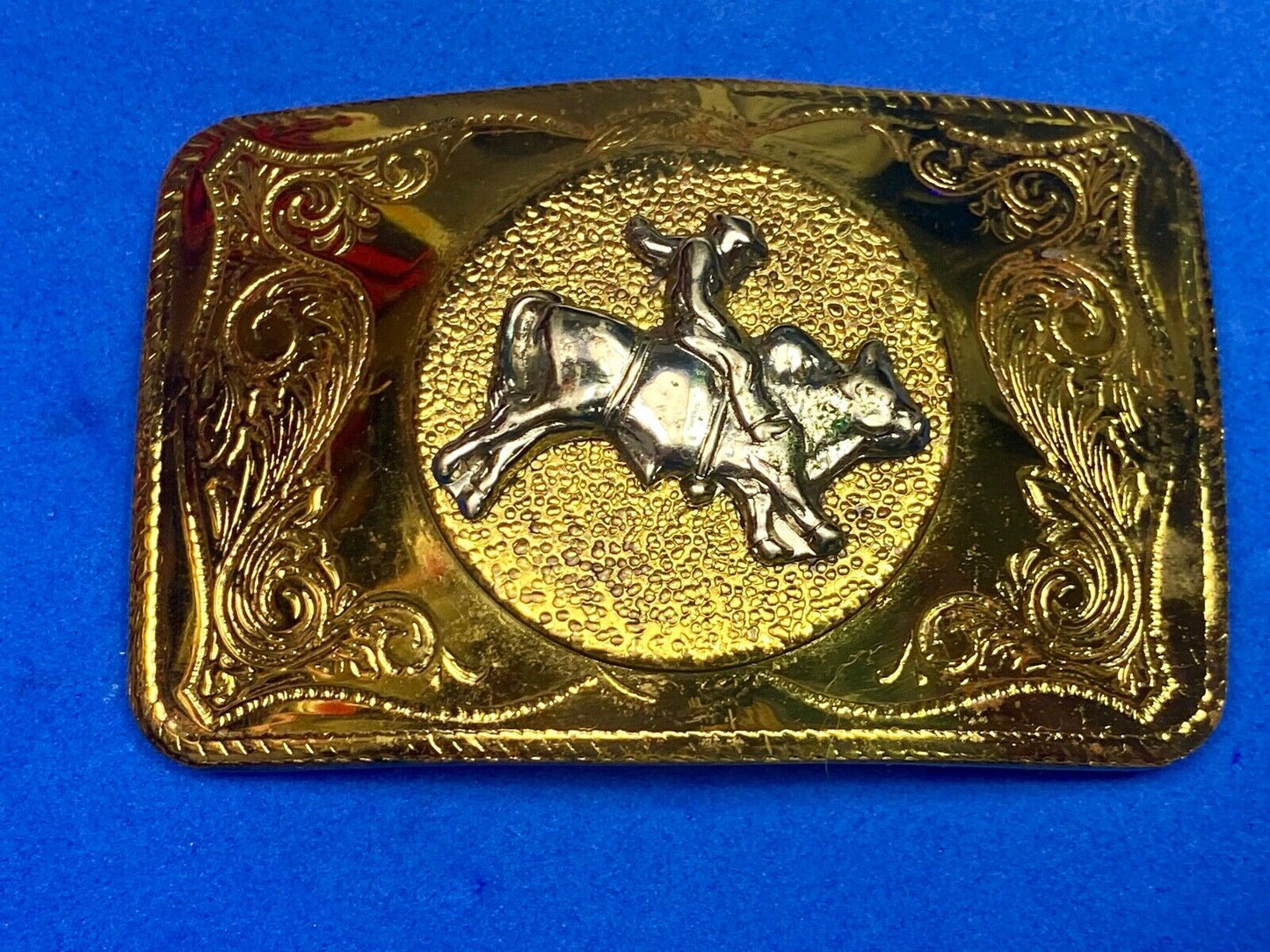 Beautiful ornate solid brass rodeo cowboy on rectangular western belt buckle