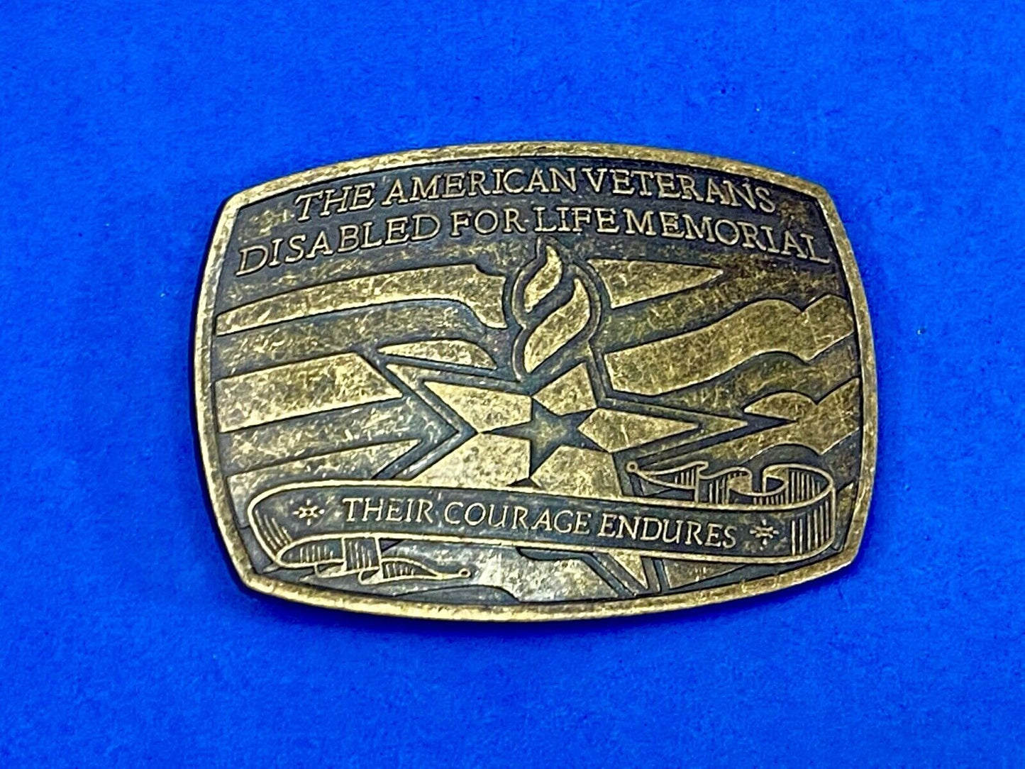 The American Disable Veteran Memorial Belt Buckle Their Courage Endures.