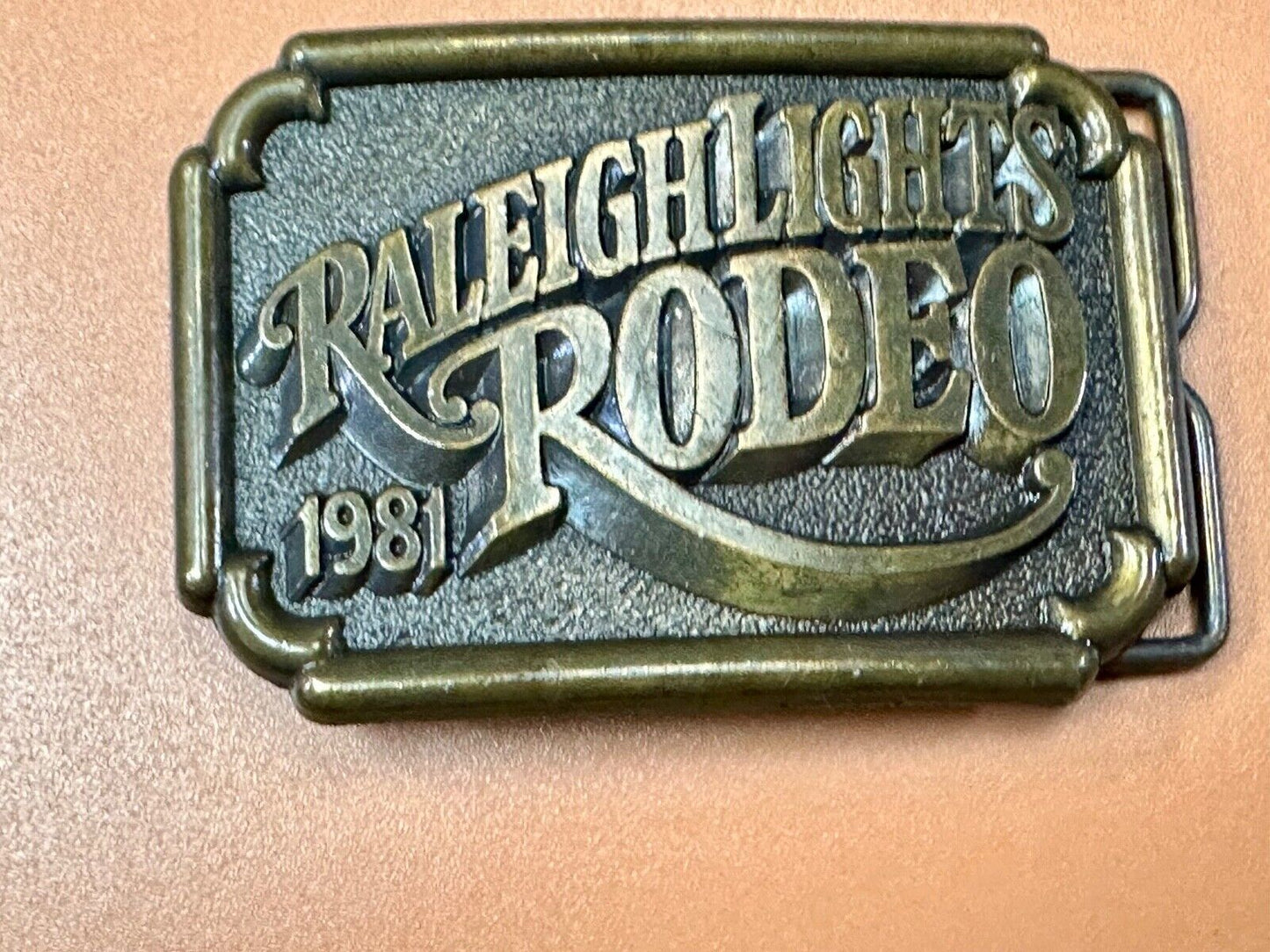 Vintage 1981 RALEIGH LIGHTS RODEO CIGARETTES SPONSOR Brass tone belt buckle