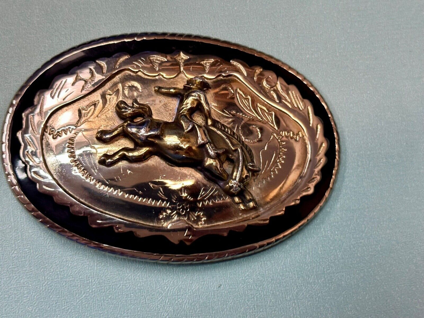 Beautiful Cowboy Saddle Bronc western black silver gold color belt buckle