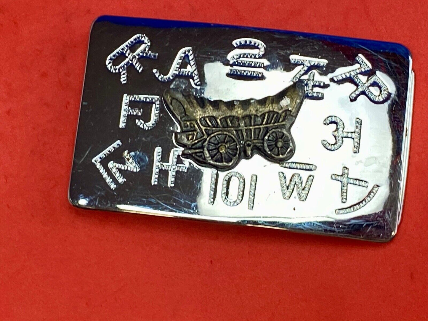 Vintage Chaimbers covered wagon western belt buckle with branding signs marks